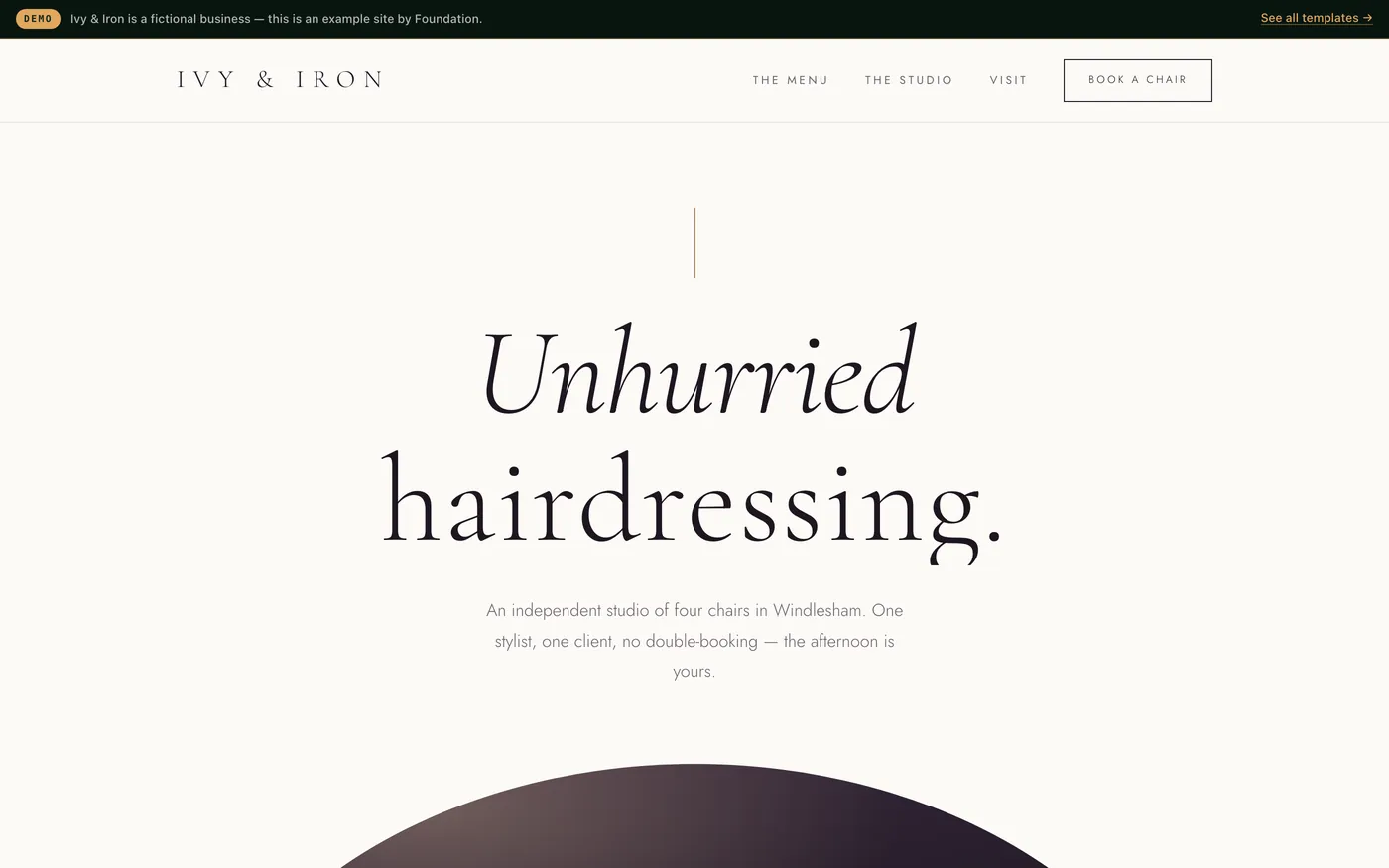 A hair salon website in aubergine and brass with italic serif headlines, a stylist list and a price menu.